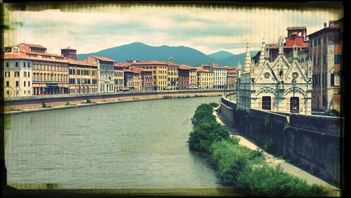 View of canal with buildings in background