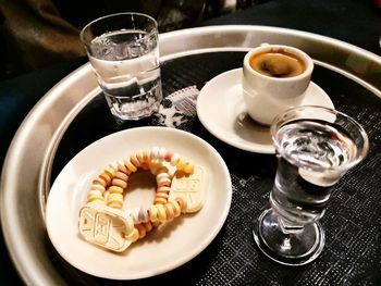 High angle view of coffee served on table