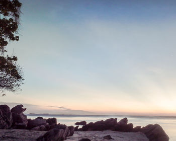 Scenic view of sea and rocks against sky