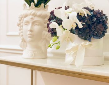 Close-up of white flowers on table