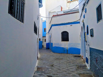 Alley amidst buildings in city