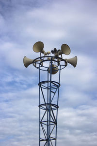 Low angle view of loudspeaker against sky