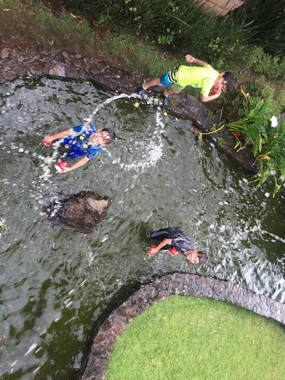 high angle view, puddle, water, day, outdoors, stream, overhead view, nature, multi colored, muddy, tranquility, non-urban scene