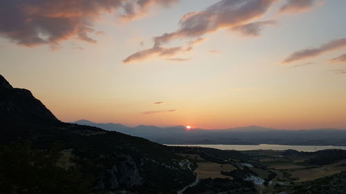 Scenic view of mountains against sky during sunset