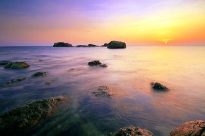 Scenic view of sea at sunset