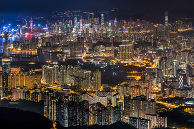 High angle view of city lit up at night