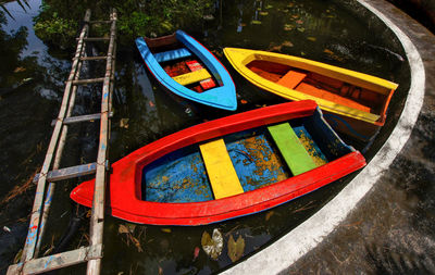 High angle view of multi colored boat moored on lake