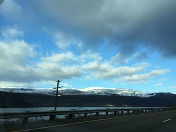 Scenic view of mountains against cloudy sky