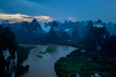 Scenic view of mountains against sky during sunset