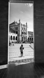 People walking in front of historical building