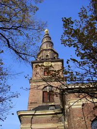 Low angle view of built structure against clear blue sky