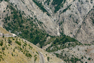 High angle view of road amidst mountains