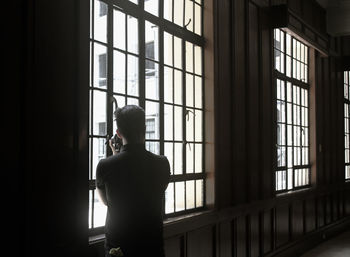 Woman standing in the dark