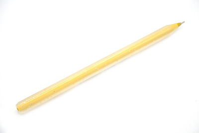 Close-up of colored pencils against white background