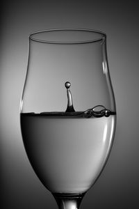 Close-up of beer glass against white background