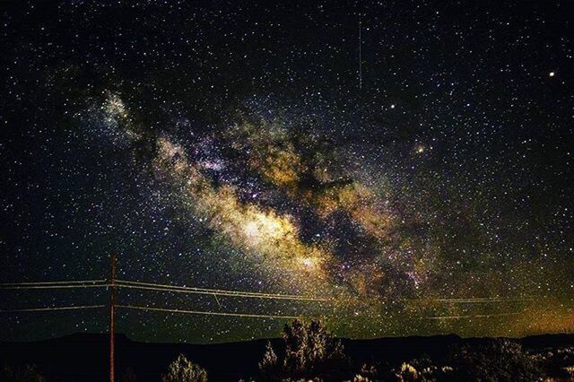 LOW ANGLE VIEW OF STAR FIELD AGAINST SKY