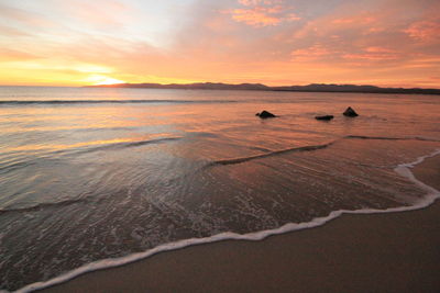 Scenic view of sea against sky during sunset