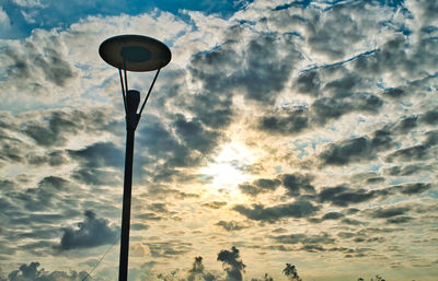 Low angle view of street light against sky