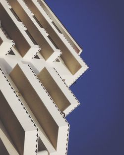 Low angle view of building against clear blue sky