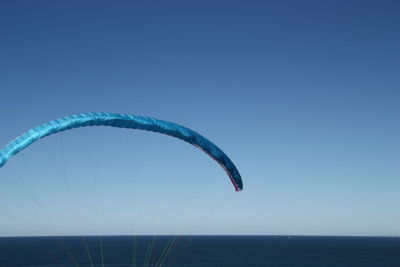 View of calm blue sea against clear sky