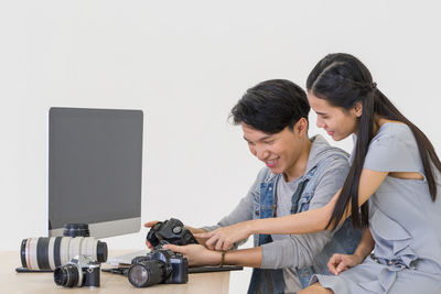 Young couple looking at camera