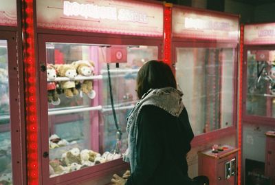 Rear view of woman standing at home