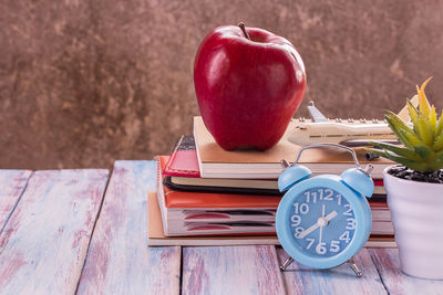 Close-up of red apple on table