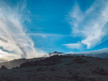 Scenic view of arid landscape against sky