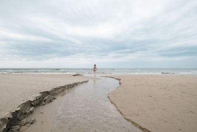 Scenic view of beach against sky