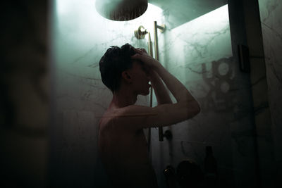 Woman standing in bathroom at home