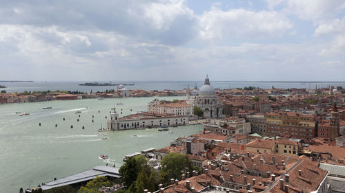 High angle view of buildings in city against sky