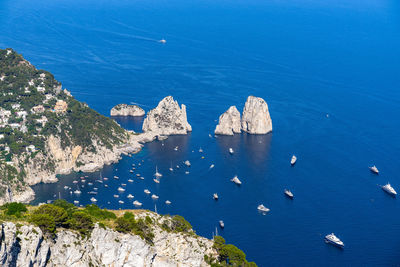 The faraglioni, the most famous tourist attraction of capri viewed from monte solaro, italy