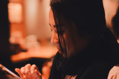 Close-up portrait of woman looking away