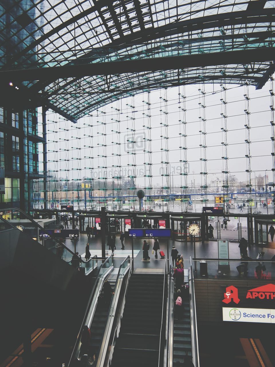 transportation, mode of transportation, architecture, built structure, public transportation, rail transportation, travel, indoors, day, city, train, glass - material, incidental people, land vehicle, railroad track, railroad station, track, station, modern, ceiling, waiting