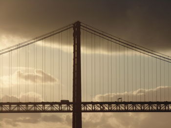 Large bridge against cloudy sky