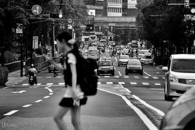Woman walking on road
