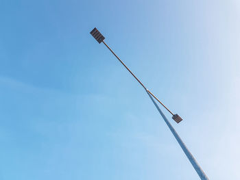 Low angle view of street light against sky