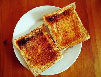 Directly above shot of served bread on wooden table