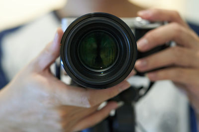 Close-up of hand holding camera