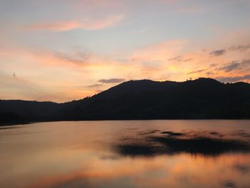 Scenic view of lake against sky during sunset