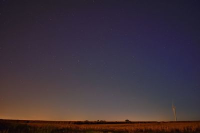 Scenic view of field against sky at night