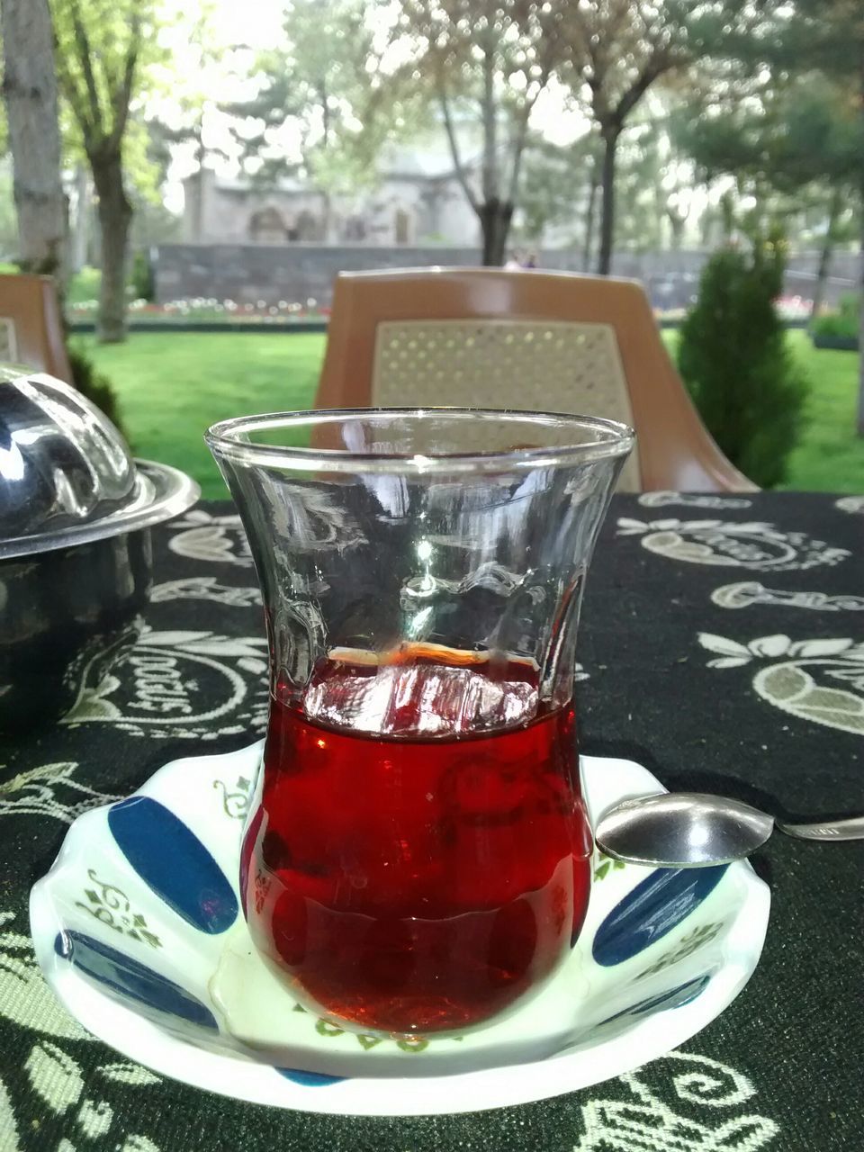 food and drink, drink, refreshment, table, freshness, focus on foreground, drinking glass, close-up, red, still life, alcohol, glass - material, restaurant, healthy eating, drinking straw, cocktail, day, wineglass, juice, food