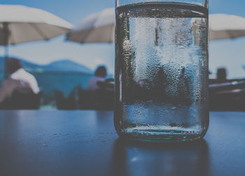 Close-up of wet glass on table