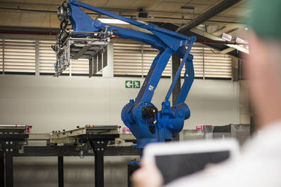 Worker using tablet in factory