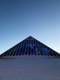 Low angle view of building against blue sky