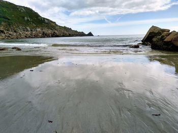 Scenic view of beach against sky