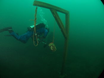 Midsection of person swimming in sea