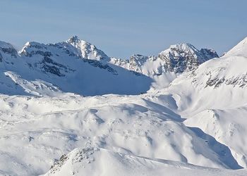 Scenic view of snow covered mountains