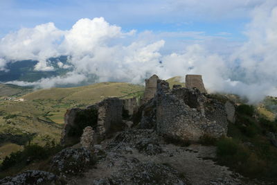 Old ruin building against cloudy sky