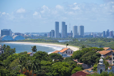 High angle view of city and buildings against sky